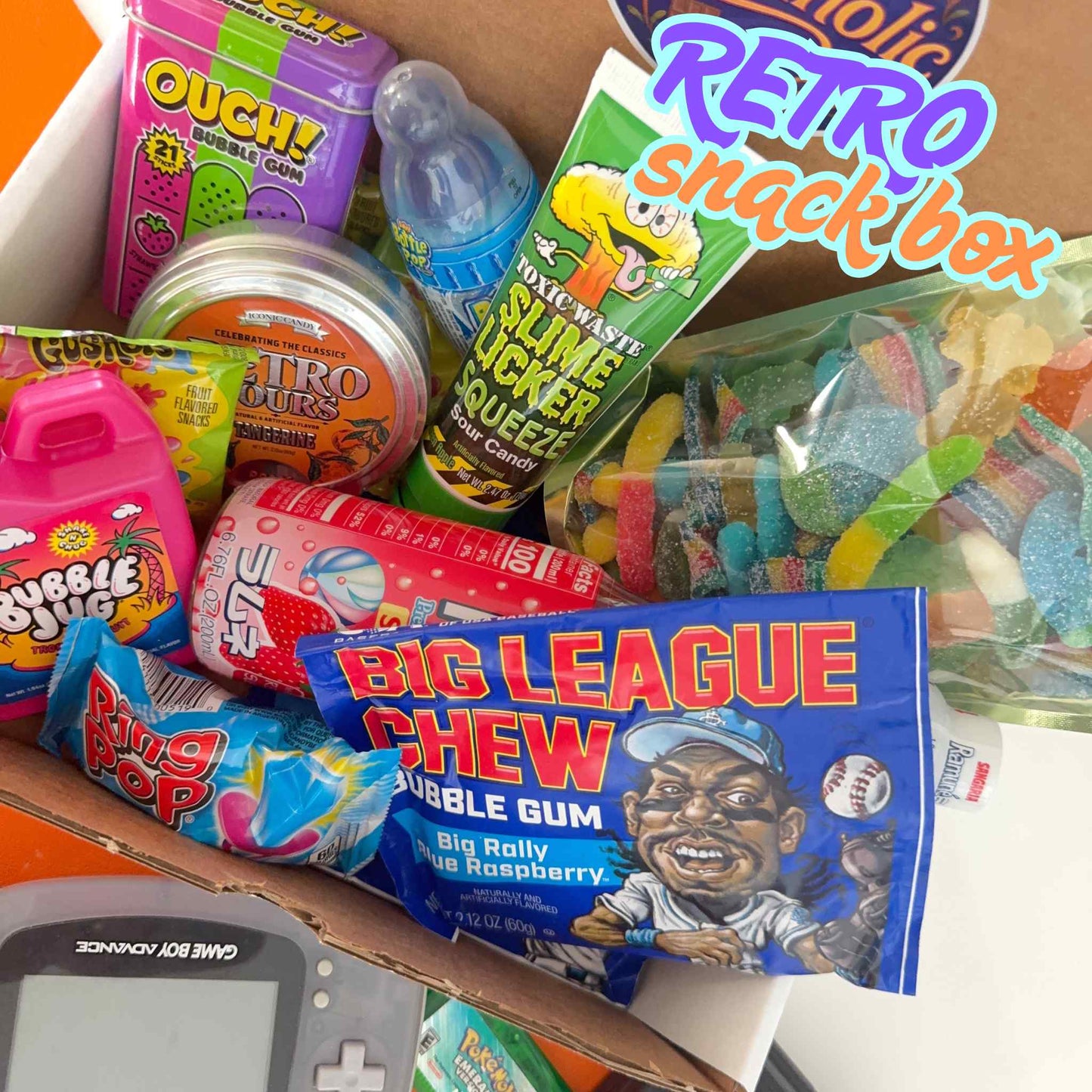 Assorted retro candy and toys in a box labeled 'Retro Snack Box'.