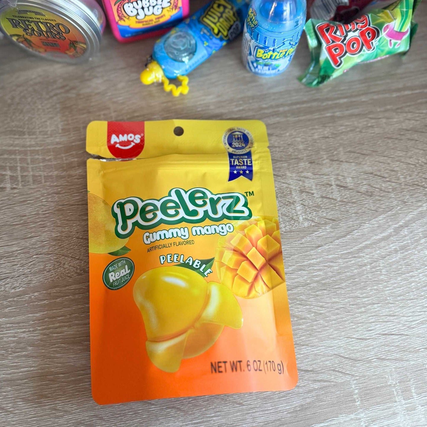 Mango Peelerz with nostalgic candy - wood surface