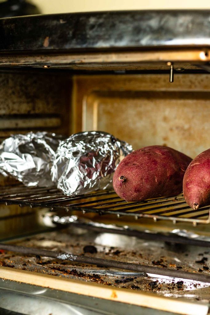 "Baked Japanese sweet potatoes, also known as Yaki Imo, with a crispy and caramelized red-purple skin, and a creamy, sweet, and fluffy texture. A popular and nutritious snack, perfect for fall and winter inside oven