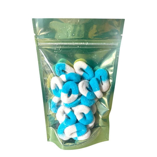 Clear resealable bag filled with blue and white sugar-coated gummy rings, showcasing chewy blue raspberry candy